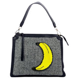 Banaan Reversible Paillette Strijk Embleem Patch op een grijze canvas tas