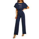 Cocktail Cosmos Strass Strijk Applicatie op de top van een blauw broekpak
