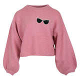 Zonnebril Strass Strijk Embleem Patch op een roze sweater