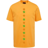 Bloem Bloemetje Strijk Embleem Patch Oranje samen met de groene versie  op een oranje t-shirtje