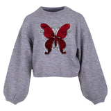 Vlinder Op Naai Embleem Patch Reversible Paillette Zilver Rood op een grijze sweater