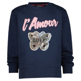 Vlinder Reversible Paillette Love Tekst XL Op Naai Patch op een blauwe sweater