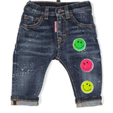 Smiley Strijkpatch Sparkle Sequin Iron On samen met twee andere kleuren op een kleine spikerbroek