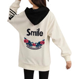 Happy Right Now Tekst Bloem Tak XXL Strijk Patch Embleem samen met een strass smile strijk embleem op de rugzijde van een ecru hoodie