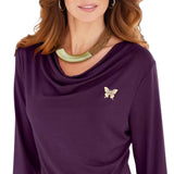 Broche Sierspeld Vlinder Paarlemoer Strass Goud op een aubergine paarse longsleeve 