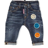 Smiley Strijk Patch Sequin Iron On samen met twee ander kleuren op een kleine spijkerbroek