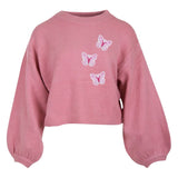 Drie maal de Vlinder Paillette Strijk Embleem Patch Roze Wit op een roze sweater