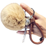 Close-up van de Sleutelhanger Pluche Pom Tas Hanger Beige