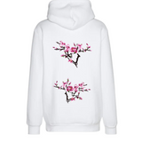 Twee takken van de Magnolia Bloesem tak Opnaai Embleem Patch Set op de rugzijde van een witte Hoodie