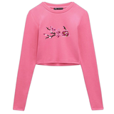 Magnolia Bloesem tak Opnaai Embleem Patch Middelste op een roze longsleeve