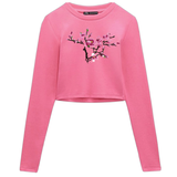 Magnolia Bloesem tak Opnaai Embleem Patch Rechts op een roze longsleeve