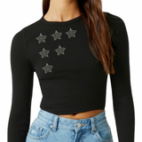 zes maal de Strass Ster Strijk Applicatie op een zwarte longsleeve