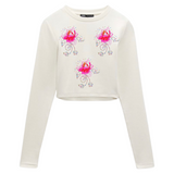 Drie maal de Lelie Bloem Rhinestone Strass-steentjes Strijk Applicatie op een witte longsleeve