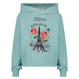 Eiffeltoren Haute Couture Vintage Strijk Applicatie op een blauw groene hoodie